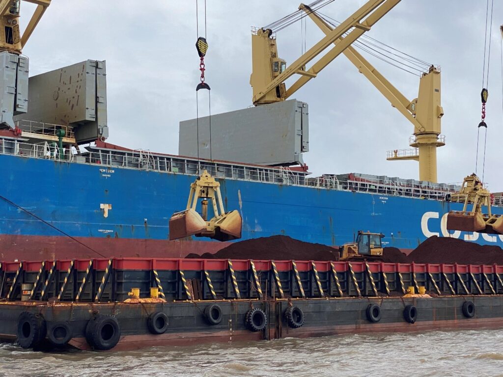 Ship being loaded from Barges